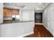Modern kitchen with stainless steel appliances, granite countertops, and a breakfast bar overlooking the living area at 1209 E Cumberland Ave # 604, Tampa, FL 33602