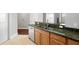 Modern kitchen featuring stainless steel dishwasher and granite countertops at 1209 E Cumberland Ave # 604, Tampa, FL 33602