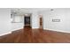 Spacious living area showing hardwood floors, neutral paint, and an open layout leading to the kitchen at 1209 E Cumberland Ave # 604, Tampa, FL 33602