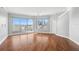 Bright and airy living room with hardwood floors and expansive windows offering city views at 1209 E Cumberland Ave # 604, Tampa, FL 33602