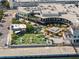 An aerial view features an outdoor seating area with green spaces, restaurants, and a waterfront view at 1209 E Cumberland Ave # 604, Tampa, FL 33602