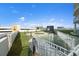 A view from a rooftop terrace, featuring walking paths, green spaces, and city views, offering a serene escape at 1209 E Cumberland Ave # 604, Tampa, FL 33602