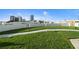 A rooftop terrace showcasing green space with a walking path and city skyline views, providing a unique urban oasis at 1209 E Cumberland Ave # 604, Tampa, FL 33602