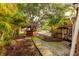 Backyard Tiki Bar with lush landscaping, creating a private oasis at 121 28Th N Ave, St Petersburg, FL 33704