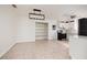 Dining area with built-in shelving, tile floor, and open to the adjacent kitchen at 121 28Th N Ave, St Petersburg, FL 33704