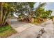 Driveway has a garage and tiki bar with landscaping at 121 28Th N Ave, St Petersburg, FL 33704