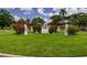 A manicured entrance with decorative pergolas, flowers, and lush landscaping at 121 28Th N Ave, St Petersburg, FL 33704
