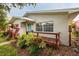 Charming home with front yard landscaping and a blue front door at 121 28Th N Ave, St Petersburg, FL 33704