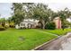 This property showcases a well-manicured lawn, complemented by lush landscaping at 121 28Th N Ave, St Petersburg, FL 33704