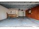 Well-lit garage featuring ample storage, workbench, and convenient access points at 121 28Th N Ave, St Petersburg, FL 33704