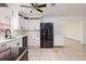 Modern kitchen featuring white cabinets, quartz countertops, and stainless steel appliances at 121 28Th N Ave, St Petersburg, FL 33704