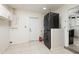 Modern laundry area with stacked washer and dryer units next to the kitchen at 121 28Th N Ave, St Petersburg, FL 33704
