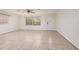 Spacious living room with neutral tile flooring and a window providing natural light at 121 28Th N Ave, St Petersburg, FL 33704