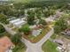 Property outline. Beautiful aerial shot highlights community, showcasing well-spaced homes, green spaces, and tranquil layout at 12324 Pittsfield Ave, Tampa, FL 33624