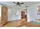 Cozy dining area featuring a wooden hutch, ceiling fan and view into other rooms at 12631 Hobson Simmons Rd, Lithia, FL 33547