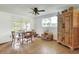 Cozy dining room with natural light, wood table, and decorative cabinet, ideal for Gathering gatherings at 12631 Hobson Simmons Rd, Lithia, FL 33547