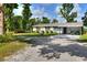 Charming single-story home featuring a large front yard and ample parking space at 12631 Hobson Simmons Rd, Lithia, FL 33547