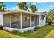 View of the screen porch with lawn and backyard at 12631 Hobson Simmons Rd, Lithia, FL 33547
