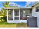 View of the exterior screened porch with access to the backyard at 12631 Hobson Simmons Rd, Lithia, FL 33547