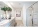 Contemporary bathroom with dual sinks, granite countertops, and a glass-enclosed shower at 13245 Tropical Breeze Way, Hudson, FL 34669