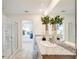 Modern bathroom featuring dual sinks, granite countertops, and a glass-enclosed shower at 13245 Tropical Breeze Way, Hudson, FL 34669