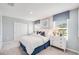 Cozy bedroom with neutral walls, carpeted floor, and comfortable furnishings at 13245 Tropical Breeze Way, Hudson, FL 34669