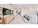 Cozy bonus room with a large TV, comfortable seating, and modern decor at 13245 Tropical Breeze Way, Hudson, FL 34669