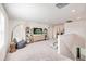 Spacious bonus room with comfortable seating, a large TV, and modern design elements at 13245 Tropical Breeze Way, Hudson, FL 34669