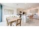 Open-concept kitchen and dining area with modern appliances, countertops, and ample seating at 13245 Tropical Breeze Way, Hudson, FL 34669