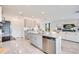 Open-concept kitchen with an island and stainless steel appliances and view to living area at 13245 Tropical Breeze Way, Hudson, FL 34669