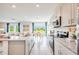 Bright kitchen featuring stainless steel appliances, granite countertops, and a view to the backyard at 13245 Tropical Breeze Way, Hudson, FL 34669