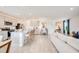 Spacious kitchen flows into the living area with bar seating, perfect for entertaining guests at 13245 Tropical Breeze Way, Hudson, FL 34669