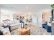 Open-concept living space with modern furnishings, a stylish kitchen, and plenty of natural light at 13245 Tropical Breeze Way, Hudson, FL 34669
