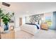 Bright and airy main bedroom featuring contemporary decor and a comfortable layout at 13245 Tropical Breeze Way, Hudson, FL 34669
