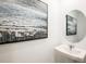 Modern powder room featuring a pedestal sink and stylish artwork at 13245 Tropical Breeze Way, Hudson, FL 34669