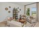 Cozy living room with natural light, stylish decor, and comfortable seating arrangement at 13548 Tropical Breeze Way, Hudson, FL 34669