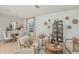 Inviting living space showcasing decor, seating, with dining area in the background at 13548 Tropical Breeze Way, Hudson, FL 34669