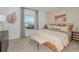 Serene main bedroom featuring a plush bed, soft lighting, and tasteful furnishings at 13548 Tropical Breeze Way, Hudson, FL 34669