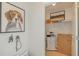Storage area features a dog portrait, shelving, and an office printer at 13548 Tropical Breeze Way, Hudson, FL 34669