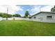 Expansive backyard featuring a well-maintained lawn and a privacy fence at 1461 S Hillcrest Ave, Clearwater, FL 33756