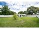 Beautiful, fenced backyard with lush green grass and a well-maintained lawn at 1461 S Hillcrest Ave, Clearwater, FL 33756