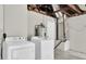 This basement features a washer, dryer, and utility equipment for the home at 1461 S Hillcrest Ave, Clearwater, FL 33756