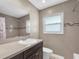 Bright bathroom features tile walls, sink, vanity and decorative tile accents at 1461 S Hillcrest Ave, Clearwater, FL 33756