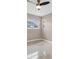 This bedroom features a ceiling fan, neutral walls, polished floor and a window for natural light at 1461 S Hillcrest Ave, Clearwater, FL 33756