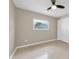 This bedroom features a ceiling fan, neutral walls, and a window for natural light and ample closet space at 1461 S Hillcrest Ave, Clearwater, FL 33756