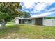 Well-maintained single-Gathering home boasting a green lawn, mature landscaping, and a serene, fenced backyard at 1461 S Hillcrest Ave, Clearwater, FL 33756