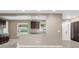 Open-concept kitchen featuring breakfast bar and dark-stained cabinets, seamlessly connects to dining space at 1461 S Hillcrest Ave, Clearwater, FL 33756