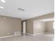 Bright, neutral living room with tile flooring, offering a blank canvas for personal decoration at 1461 S Hillcrest Ave, Clearwater, FL 33756