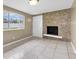 Inviting living room featuring a decorative fireplace and bright, natural light at 1461 S Hillcrest Ave, Clearwater, FL 33756