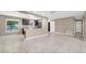 Open-concept living area with tile floors and seamless flow to kitchen at 1461 S Hillcrest Ave, Clearwater, FL 33756